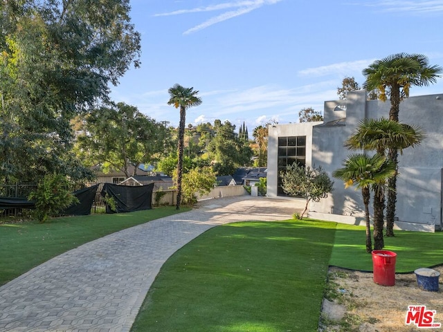 view of home's community featuring a yard