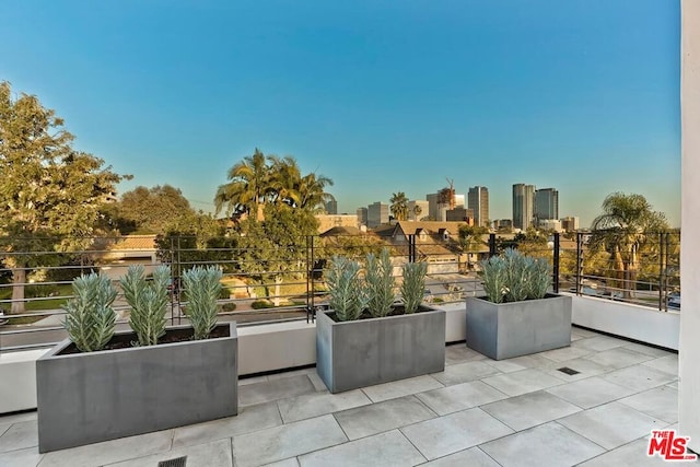 view of patio featuring a balcony