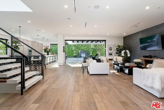 living room with light hardwood / wood-style flooring