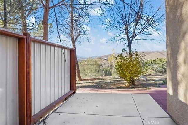 view of patio / terrace with a mountain view