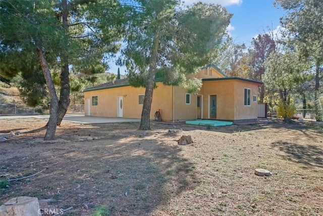 back of house featuring a patio