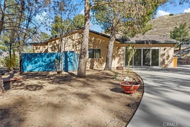 back of house featuring a mountain view