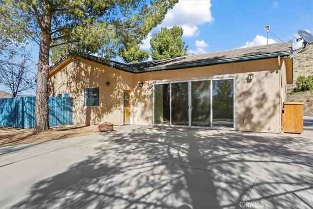 rear view of property with a patio area