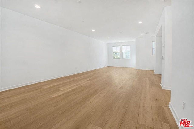 unfurnished room with light hardwood / wood-style floors