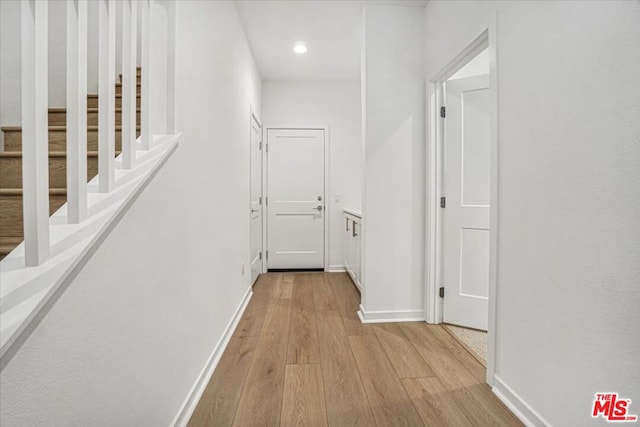 corridor featuring light hardwood / wood-style floors