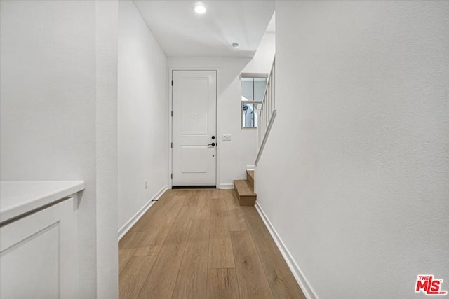 doorway to outside with light hardwood / wood-style floors