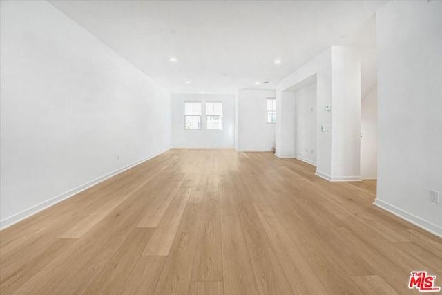 spare room with light hardwood / wood-style flooring