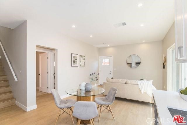 dining space with light hardwood / wood-style flooring