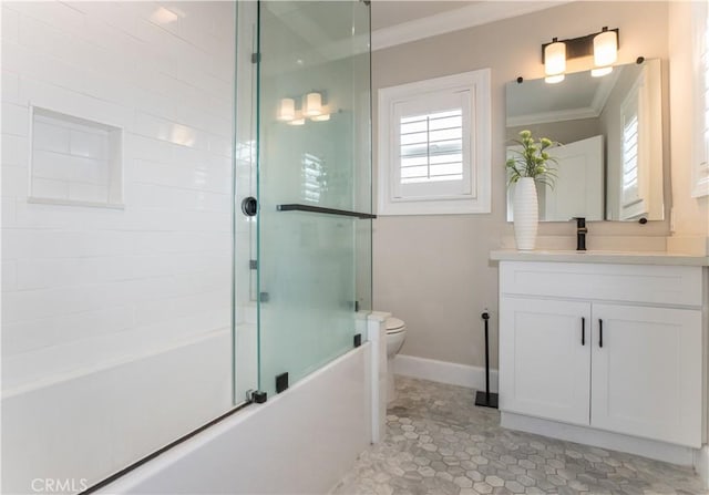 full bathroom with crown molding, plenty of natural light, shower / bath combination with glass door, and toilet