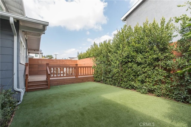 view of yard with a wooden deck