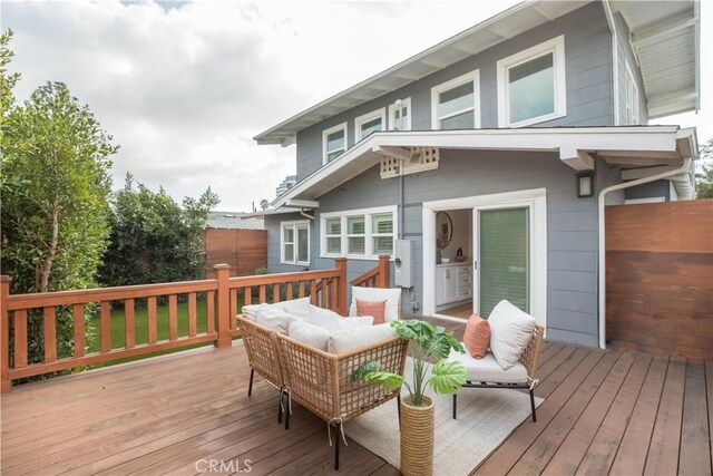 wooden deck with an outdoor hangout area