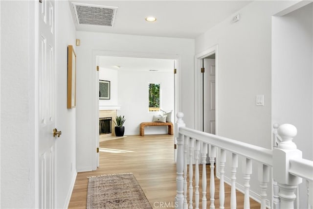 corridor featuring light hardwood / wood-style floors