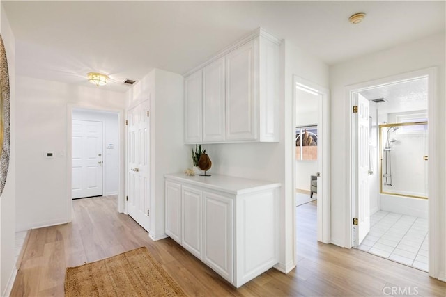 hallway featuring light hardwood / wood-style flooring