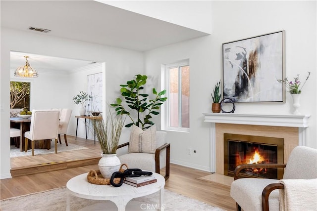 living area with plenty of natural light and light wood-type flooring