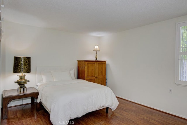 bedroom featuring dark hardwood / wood-style floors