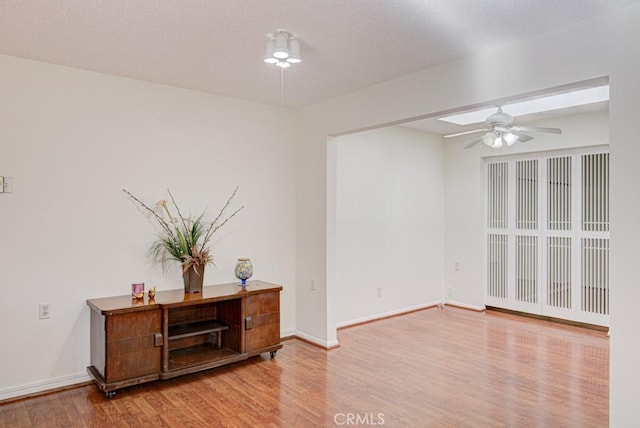 spare room featuring ceiling fan and wood-type flooring