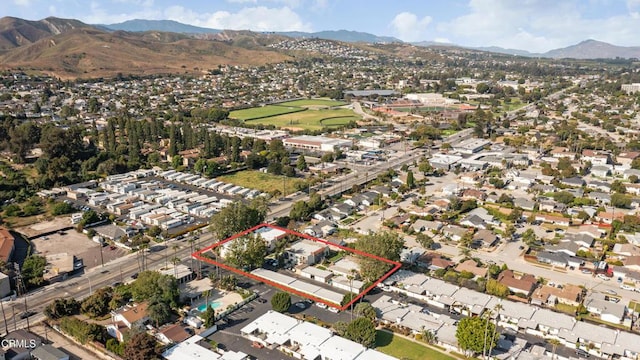 birds eye view of property featuring a mountain view