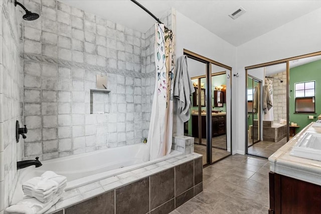 bathroom featuring vanity, tile patterned floors, and shower / bathtub combination with curtain