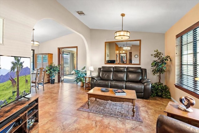 living room featuring vaulted ceiling