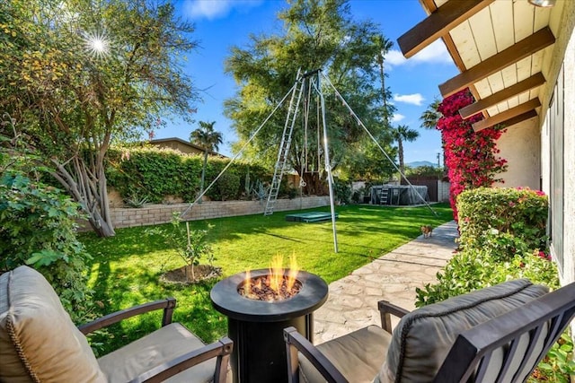 view of yard with an outdoor fire pit