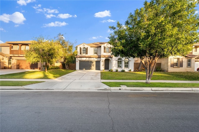 view of front of house with a garage and a front lawn