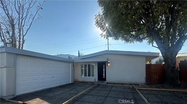 single story home with a garage