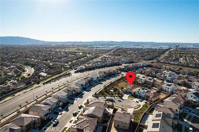 birds eye view of property with a mountain view