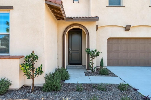 doorway to property featuring a garage