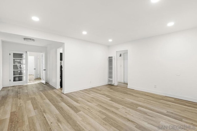 unfurnished room with light wood-type flooring