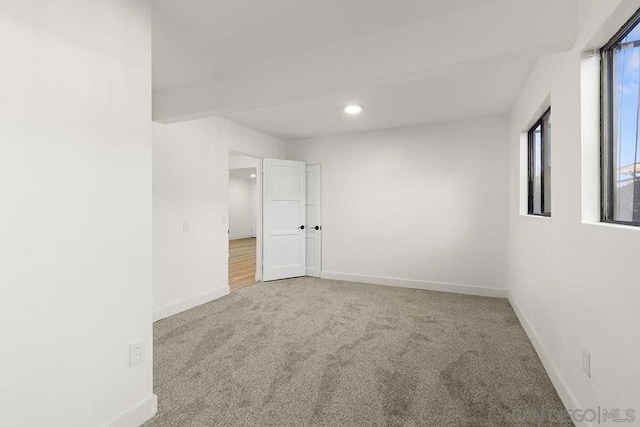 unfurnished room with carpet flooring