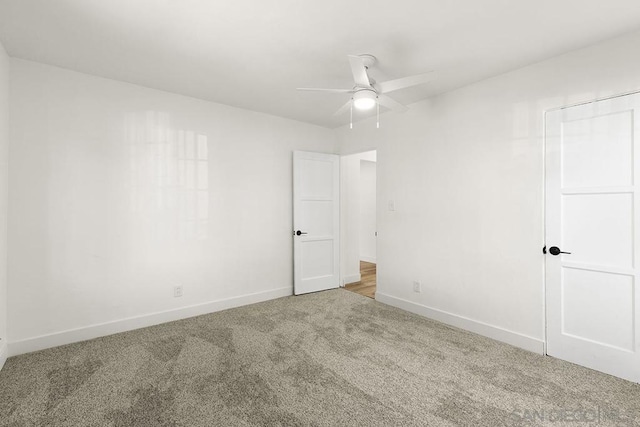 carpeted empty room with ceiling fan