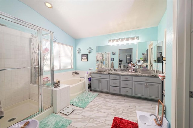 bathroom featuring plus walk in shower, lofted ceiling, and vanity