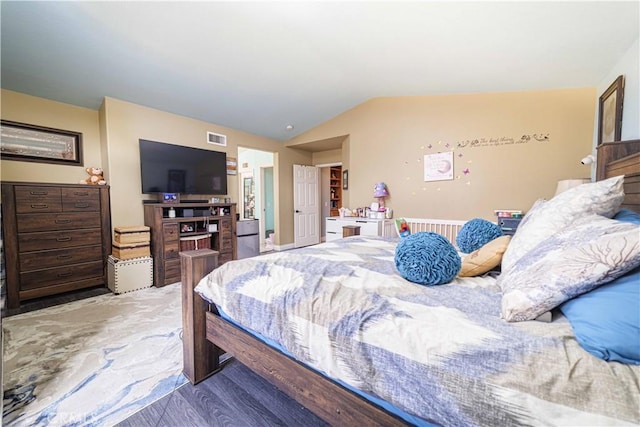 bedroom featuring lofted ceiling and wood-type flooring