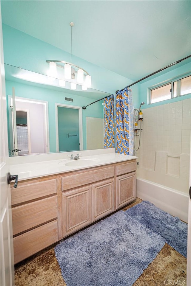 bathroom with vanity and shower / bath combination with curtain