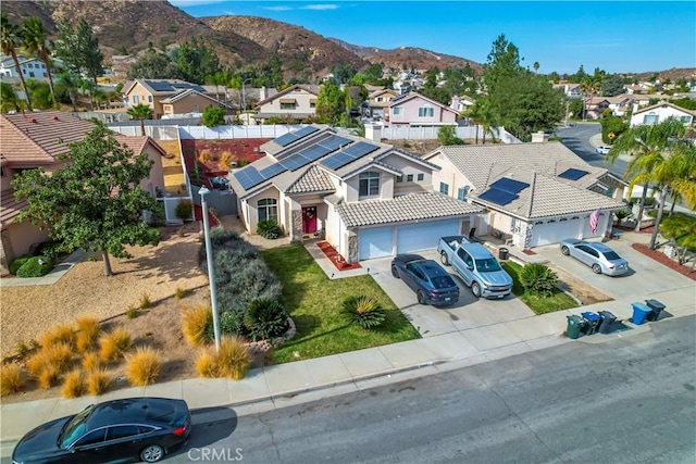 birds eye view of property with a mountain view