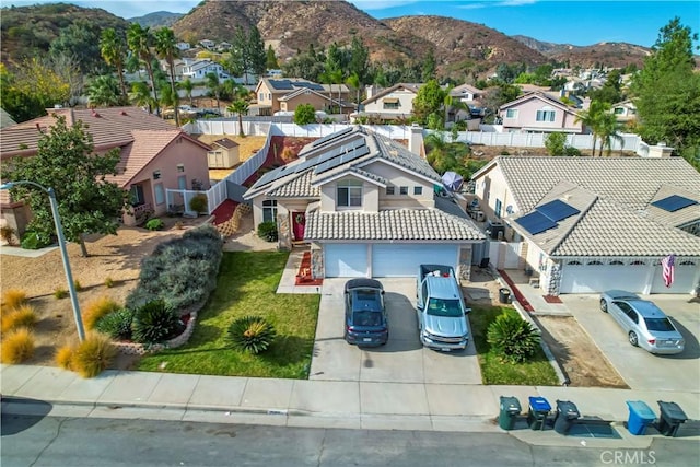 birds eye view of property with a mountain view