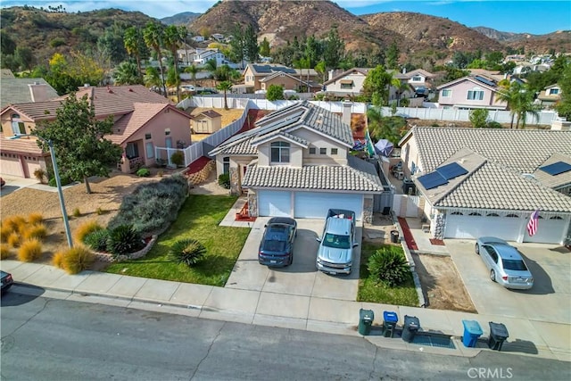 birds eye view of property with a mountain view