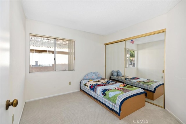 bedroom featuring carpet floors and a closet