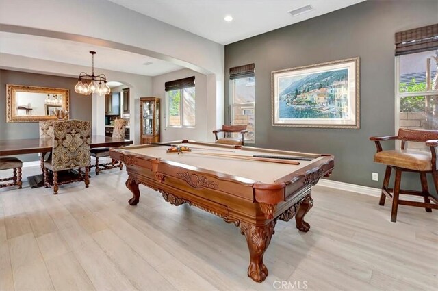 rec room with pool table, plenty of natural light, and light wood-type flooring