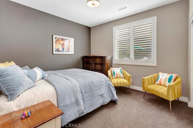 bedroom featuring carpet, visible vents, and baseboards