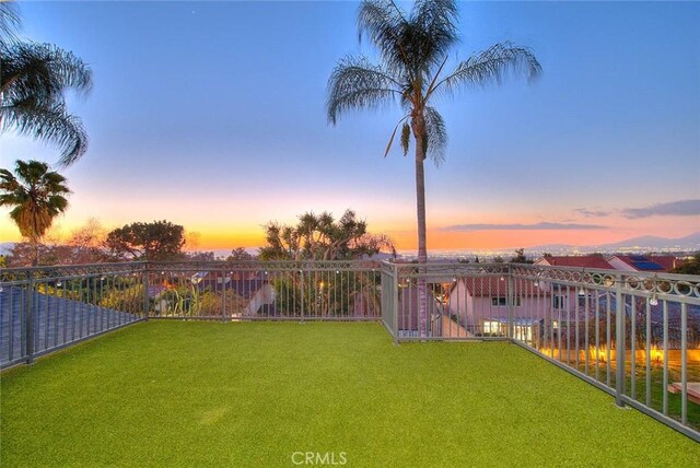 view of yard at dusk