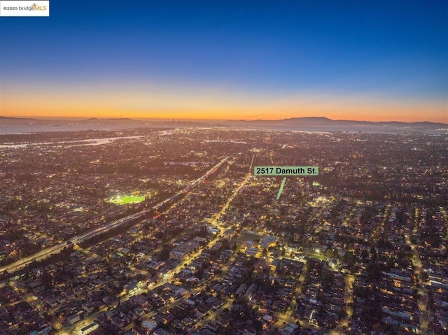 aerial view at dusk with a mountain view