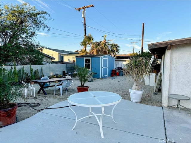 view of patio with a storage unit