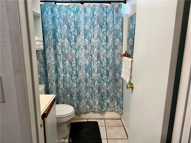 bathroom featuring vanity, a shower with curtain, tile patterned floors, and toilet