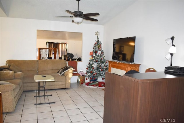 living room featuring ceiling fan and light tile patterned floors