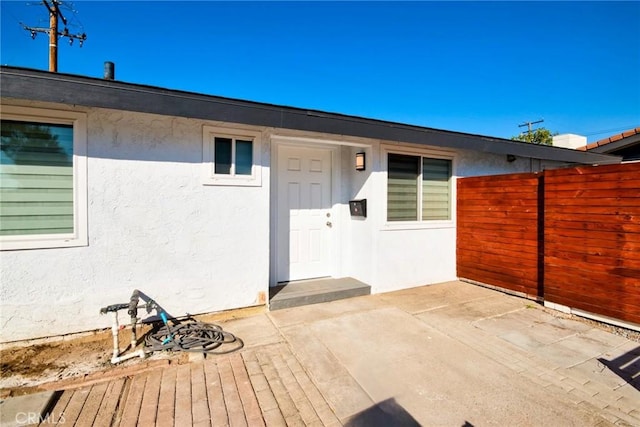 doorway to property featuring a patio