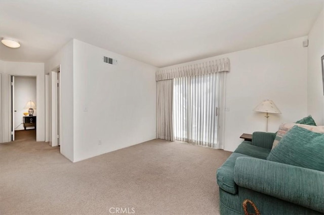 living room featuring light carpet