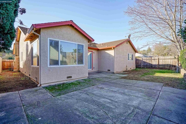 rear view of property featuring a patio area