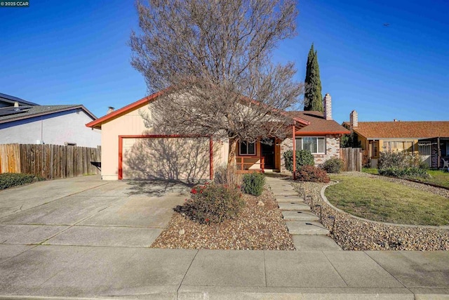 single story home featuring a front yard and a garage