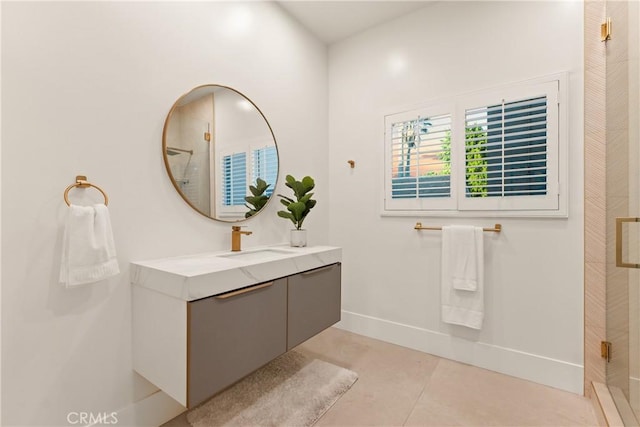 bathroom featuring walk in shower, vanity, and tile patterned floors